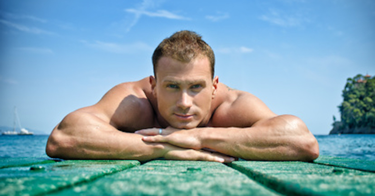 muscular man resting on dock