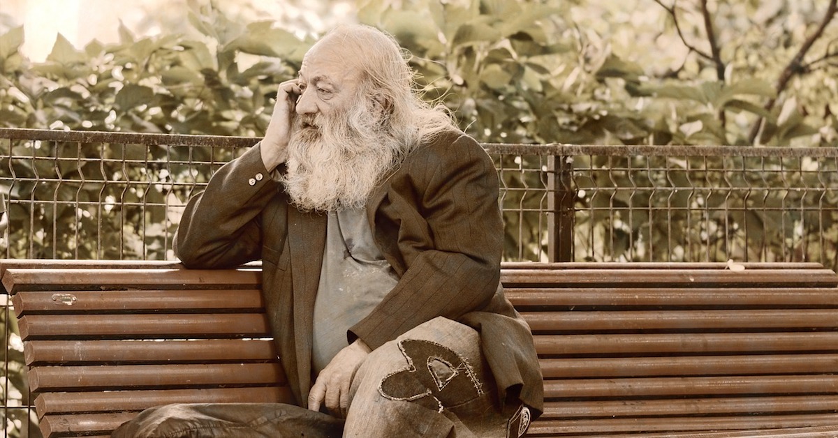 old man sitting on bench